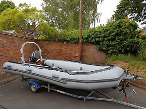 inflatable boat withe outboard and trailer