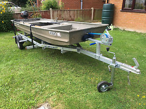 Polar Kraft Aluminium flat bottomed boat on a trailer with outboard