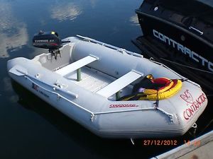 inflatable tender up to 4 passengers, with 2.3 Evinrude outboard, reg'd trailer