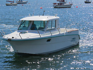 2006 OCQUETEAU 695 PILOTHOUSE SPORTS FISHER.  22 Knots 18 Knot cruise.