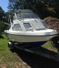 Monark Starcraft Fibreglass Cabin Cruiser with a 40 hp Johnson motor.