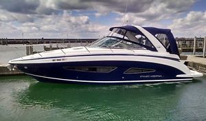 2015 Regal 32 Express Beautiful Mediteranian Blue with white Boot Stripe.