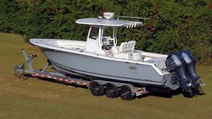 2014 Sea Hunt Gamefish 30 and trlr.  130 original one owner hours, warranty 3/17