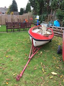 9ft fibreglass tender/fishing boat with 4hp outboard and trailer