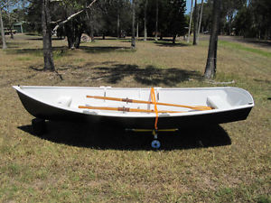 Wooden sailing rowing dinghy