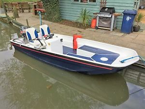 Dory type boat, 15 foot, 40hp two stroke engine.