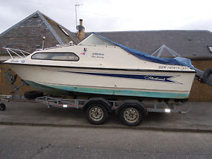 Shetland 570 on a twin axel trailer with a 50HP Mariner outboard