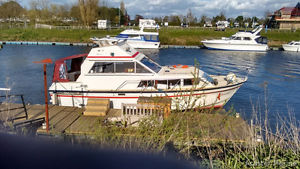 Seamaster 950 flybridge motor cruiser by twin Ford diesel engines.