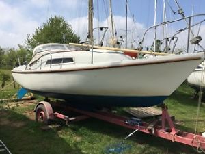 Seal 22 sailing yacht with outboards and tenders, ashore Suffolk